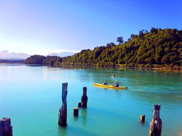 Kayaker on Okarito Lagoon - Boat trips and day cruises NZ