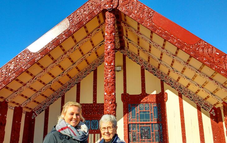 Tourists at a Maori meeting house in Rotorua