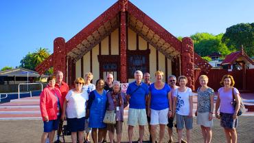 Group outside Ohinemutu Maori meeting house Rotorua - NZ North and South Island Itinerary